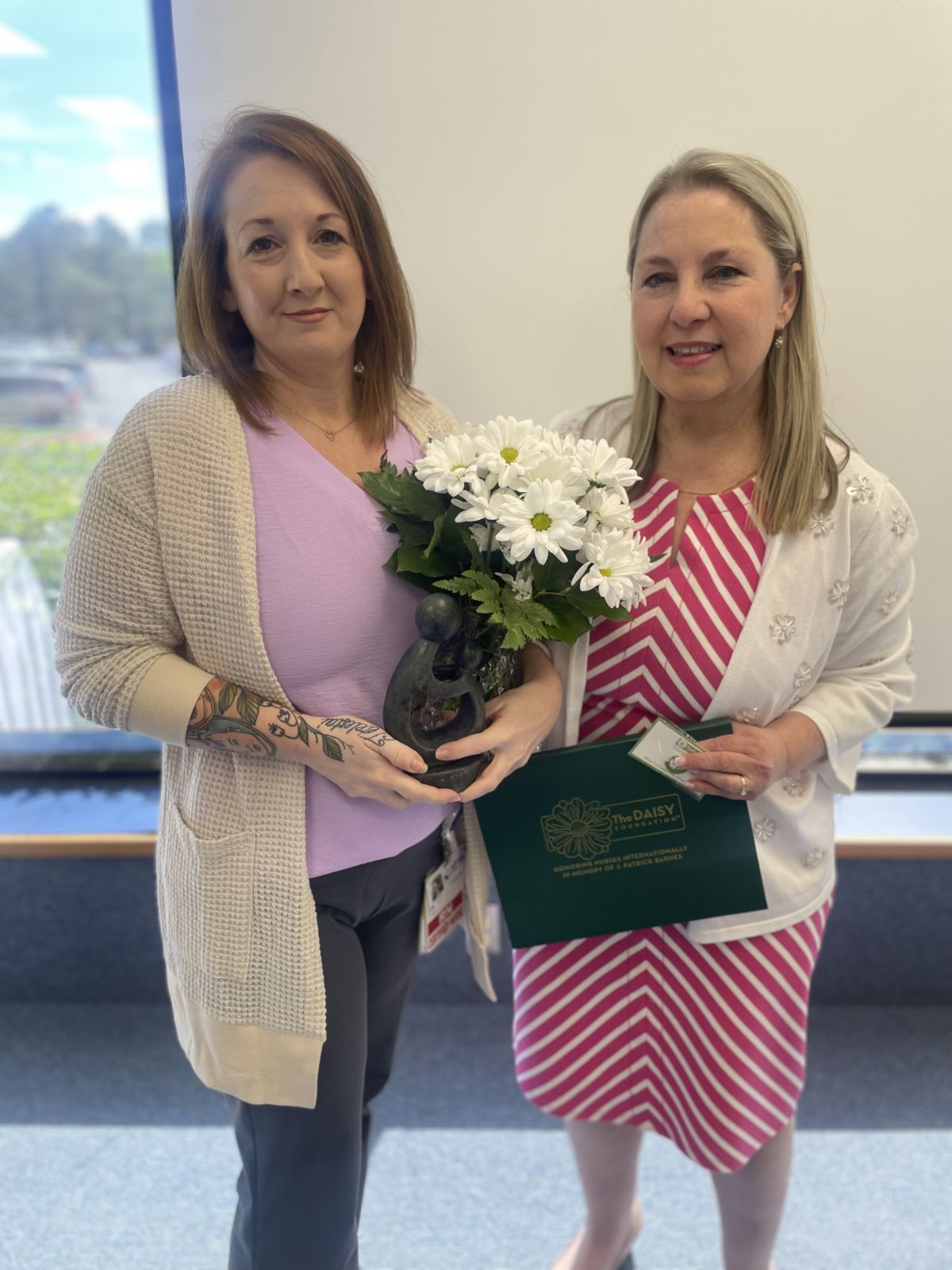 Chief Nursing Officer Lisa Wallace, right, stands with Sarah Spears